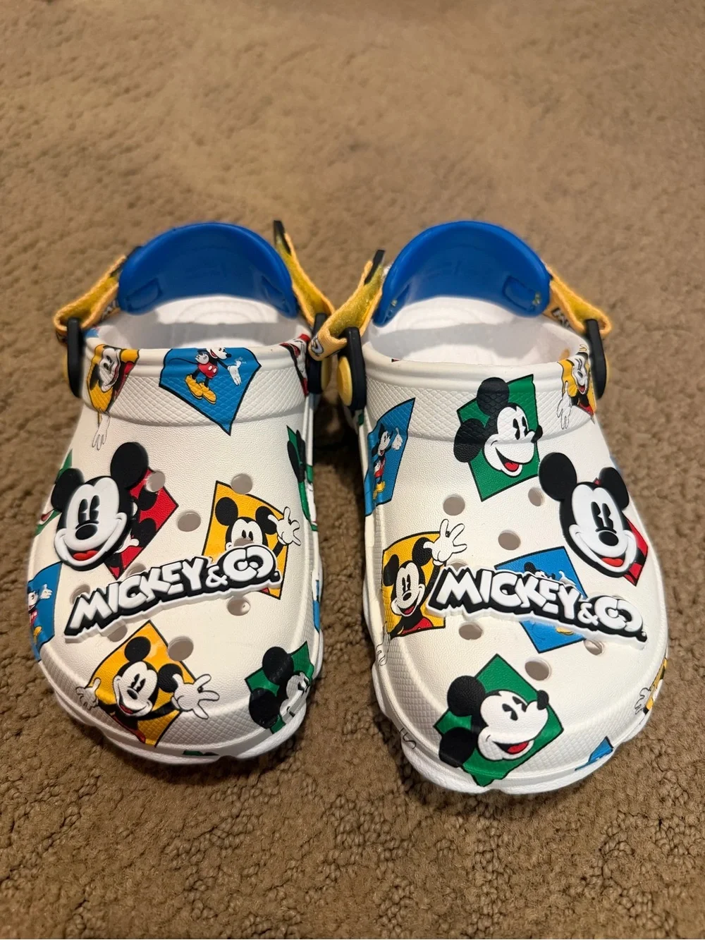 CROCS Kids' White Mickey Mouse Graphic Clogs with Blue and Yellow Accents
